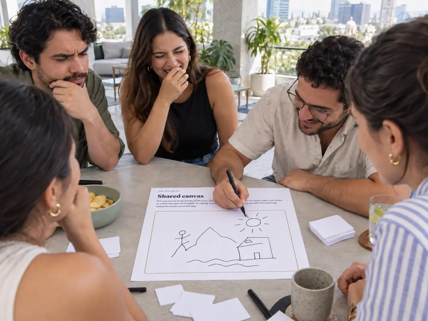 A player drawing while friends try to interpret the sketch during a game of BanterBox Sketchy Business